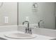 Close-up of a modern bathroom sink with a chrome faucet and bright countertop at 11294 Bella Vita Dr, Broomfield, CO 80020
