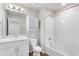 All white bathroom with large vanity, toilet, cabinet and shower-tub at 11294 Bella Vita Dr, Broomfield, CO 80020