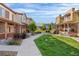 Exterior view showcasing well-maintained lawns and beautiful landscaping between townhome units at 11294 Bella Vita Dr, Broomfield, CO 80020