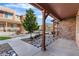 View of the front of the home with decorative rocks and landscaping, covered porch, and attractive townhome community at 11294 Bella Vita Dr, Broomfield, CO 80020