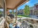 Relaxing front porch with comfortable seating and a tranquil neighborhood view at 11294 Bella Vita Dr, Broomfield, CO 80020