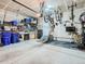 Spacious garage with ample storage, workbench, and ceiling mounted racks for bikes or gear at 11294 Bella Vita Dr, Broomfield, CO 80020
