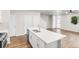 Spacious kitchen with a white island, stainless steel appliances, and hardwood flooring at 11294 Bella Vita Dr, Broomfield, CO 80020