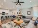 Cozy living room featuring hardwood floors, a ceiling fan, and comfortable seating at 11294 Bella Vita Dr, Broomfield, CO 80020