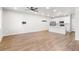 Spacious living room with open floor plan, hardwood floors and white paint at 11294 Bella Vita Dr, Broomfield, CO 80020