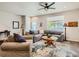 Open living area featuring hardwood floors, comfortable seating, and great natural light at 11294 Bella Vita Dr, Broomfield, CO 80020