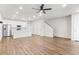 Open concept living room and kitchen with wood flooring and modern lighting at 11294 Bella Vita Dr, Broomfield, CO 80020