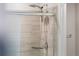 Modern shower with glass door, tiled walls, and rainfall shower head at 11294 Bella Vita Dr, Broomfield, CO 80020
