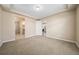 Neutral bedroom features carpet, base trim, tray ceiling, and walk-in closet at 160 Pipit Lake Way, Erie, CO 80516