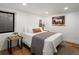 Comfortable bedroom with white walls, wood floors, and modern decor at 1640 E Virginia Ave, Denver, CO 80209