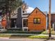 Close up of single-Gathering home featuring unique design elements, well maintained landscaping and a blue sky at 1640 E Virginia Ave, Denver, CO 80209