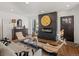 Inviting living room showcasing a sleek fireplace, hardwood flooring, and ample natural light at 1640 E Virginia Ave, Denver, CO 80209