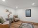 Bright sitting room with neutral walls and wood flooring at 1640 E Virginia Ave, Denver, CO 80209