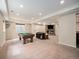 Spacious finished basement featuring a stone fireplace and lounge area at 19379 W 57Th Pl, Golden, CO 80403