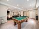 Wide angle view of carpeted basement featuring pool table and lounging area at 19379 W 57Th Pl, Golden, CO 80403