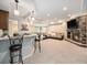 Finished basement features a wet bar, large seating area, pool table and a stone fireplace at 19379 W 57Th Pl, Golden, CO 80403