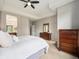Neutral bedroom with ensuite bathroom and dark wood furniture at 19379 W 57Th Pl, Golden, CO 80403