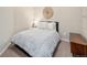 Cozy bedroom with decorative wall hanging and wood side table at 19379 W 57Th Pl, Golden, CO 80403