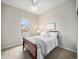 Cozy bedroom features a comfortable bed with a soft blanket and a window with natural light at 19379 W 57Th Pl, Golden, CO 80403