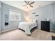 Bright bedroom featuring a ceiling fan and neutral color scheme at 19379 W 57Th Pl, Golden, CO 80403