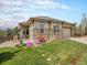 Charming single Gathering home with beautiful stone accents, a well-manicured lawn and a two car garage at 19379 W 57Th Pl, Golden, CO 80403