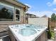 Close up of built-in hot tub overlooking adjacent homes and trees at 19379 W 57Th Pl, Golden, CO 80403