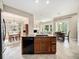 Open concept kitchen with granite countertops, stainless steel appliances, and seamless access to dining and living spaces at 19379 W 57Th Pl, Golden, CO 80403