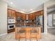 Well-equipped kitchen with stainless steel appliances, ample cabinetry, granite counters, and a functional island at 19379 W 57Th Pl, Golden, CO 80403