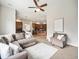 Open concept living room with views of the kitchen, breakfast nook, and comfortable seating at 19379 W 57Th Pl, Golden, CO 80403