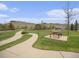 Scenic community park with walking path, picnic tables, and grassy areas, perfect for outdoor activities at 19379 W 57Th Pl, Golden, CO 80403
