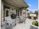 Covered patio with a built-in grill, hot tub, and outdoor seating at 19379 W 57Th Pl, Golden, CO 80403