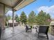 Covered patio with a built-in hot tub overlooking green space at 19379 W 57Th Pl, Golden, CO 80403