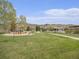 Community playground with slides and swings, featuring a walking path and mountain backdrop at 19379 W 57Th Pl, Golden, CO 80403