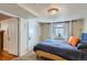 Basement bedroom featuring natural light, neutral carpet, and closet at 1120 Holly St, Denver, CO 80220