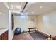 A versatile basement area with workout space, exercise ball, and ample lighting at 1120 Holly St, Denver, CO 80220