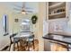 Cozy dining area with a ceiling fan, a window view, and a modern dining table at 1120 Holly St, Denver, CO 80220