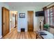 Bright home office with wood floors, ample lighting, and neutral walls at 1120 Holly St, Denver, CO 80220