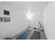 Carpeted basement area perfect for home gym, featuring yoga mats, equipment, and an electrical panel at 1050 S Monaco Pkwy # 68, Denver, CO 80224