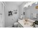This bathroom features a modern sink, toilet, minimalist wall art, and a large mirror at 1050 S Monaco Pkwy # 68, Denver, CO 80224