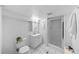 Bright basement bathroom with a tiled floor, a shower, and a classic white vanity at 1050 S Monaco Pkwy # 68, Denver, CO 80224