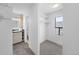 Bathroom with tiled shower and flooring, in addition to walk in closet at 1050 S Monaco Pkwy # 68, Denver, CO 80224