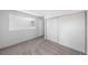 Carpeted bedroom with large closet features a window that lets in natural light at 1050 S Monaco Pkwy # 68, Denver, CO 80224