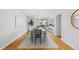 Bright dining area with contemporary lighting and view of the outdoor space at 1050 S Monaco Pkwy # 68, Denver, CO 80224