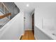 Entryway featuring hardwood floors, stairs, and modern design elements at 1050 S Monaco Pkwy # 68, Denver, CO 80224