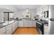Updated kitchen with stainless steel appliances, granite countertops, and natural light at 1050 S Monaco Pkwy # 68, Denver, CO 80224