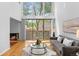 Bright living room with large windows, fireplace, and modern decor at 1050 S Monaco Pkwy # 68, Denver, CO 80224