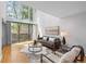 Inviting living room with stylish furnishings, large windows, and natural light at 1050 S Monaco Pkwy # 68, Denver, CO 80224
