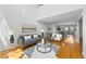 Spacious living area with modern decor, plush seating, and hardwood floors at 1050 S Monaco Pkwy # 68, Denver, CO 80224