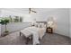 Bright main bedroom with large windows, plush carpet, and tasteful decor at 1050 S Monaco Pkwy # 68, Denver, CO 80224