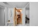 Bathroom with access to a wooden sauna; features a white tiled floor at 1050 S Monaco Pkwy # 68, Denver, CO 80224